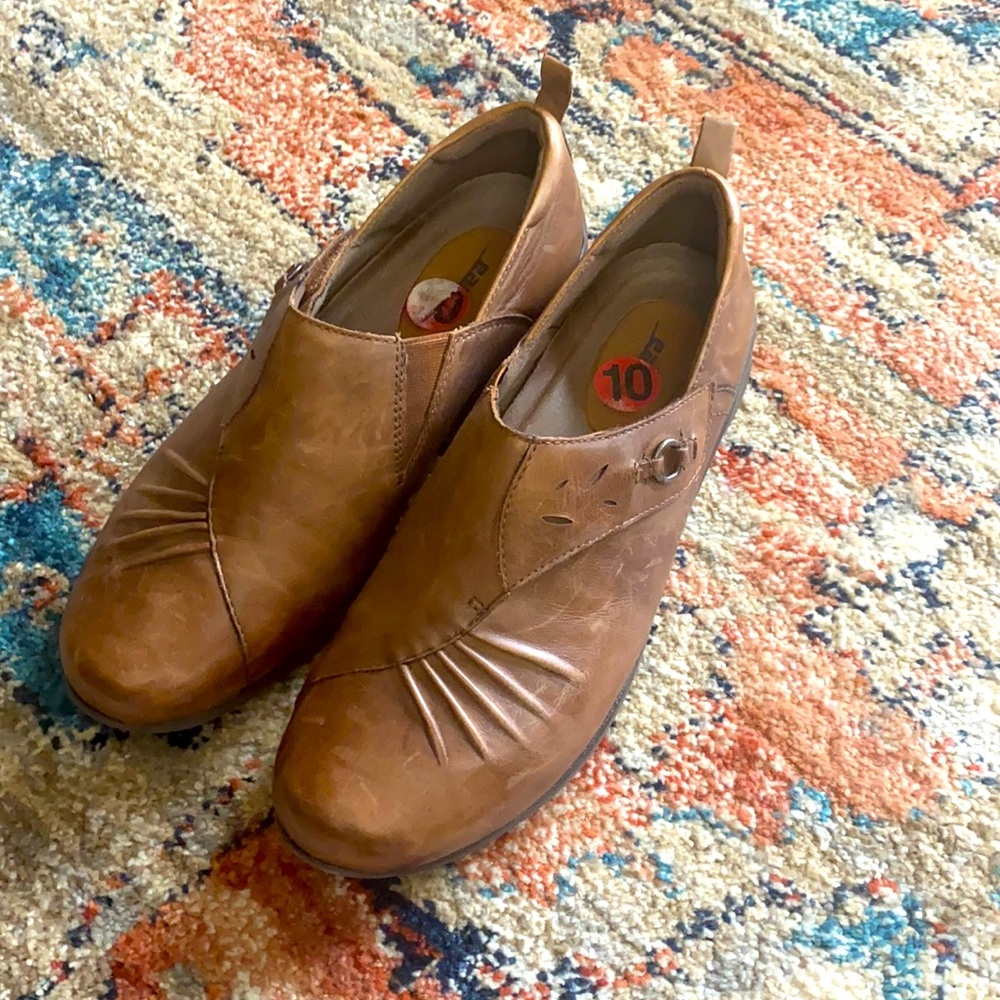 Brown shoes by earth